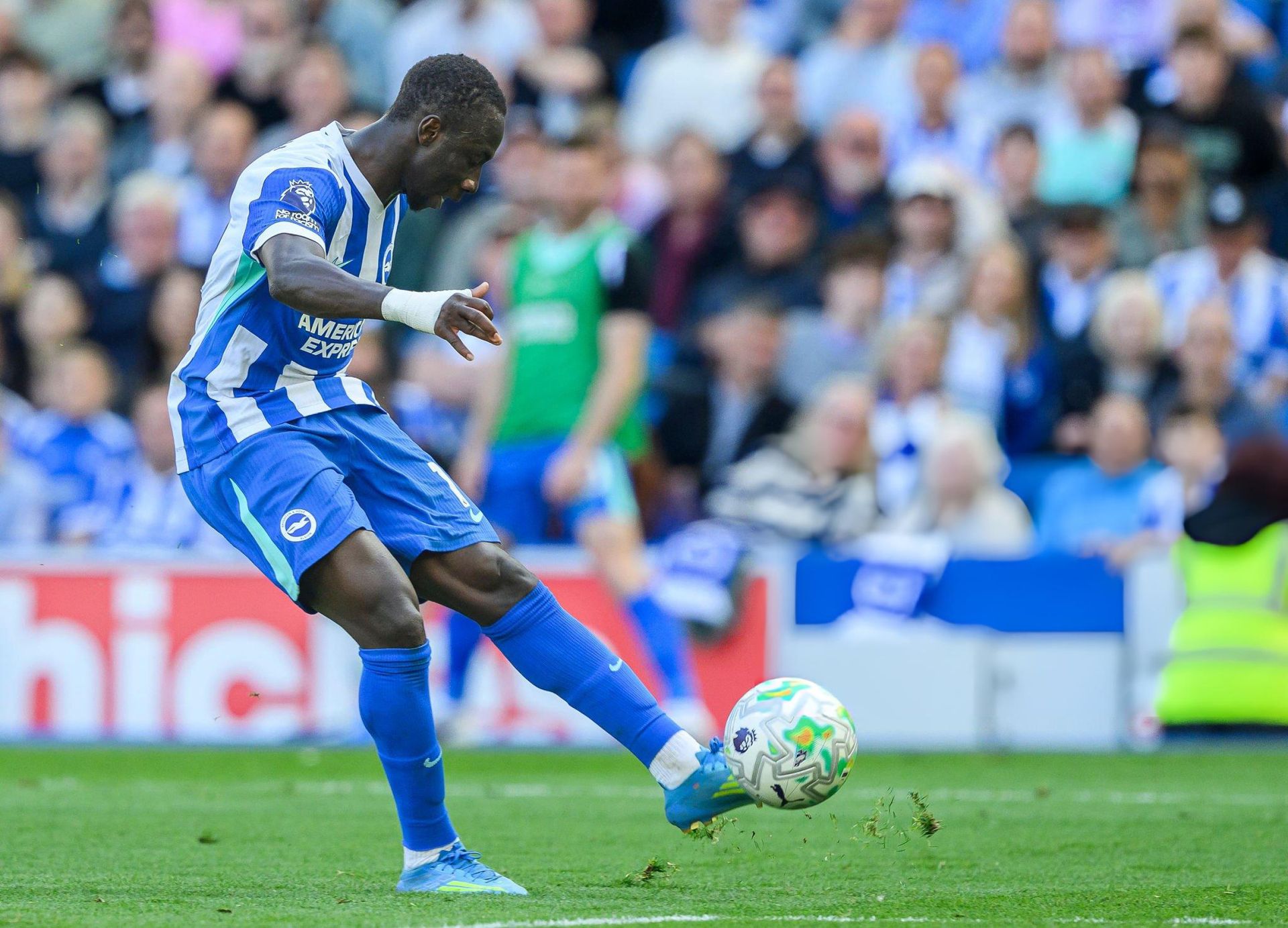 Brighton & Hove Albion player strikes the ball during a Premier League match