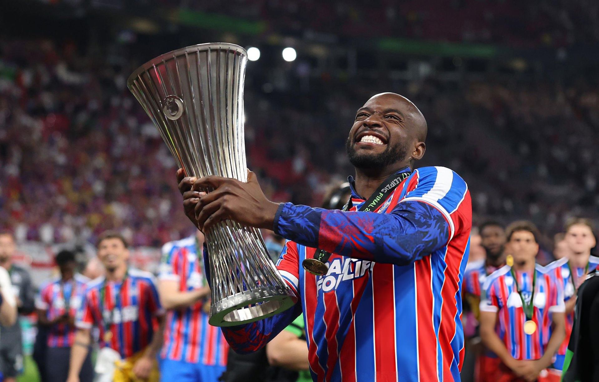 Crystal Palace players celebrate with the UEFA Conference League trophy in Leipzig
