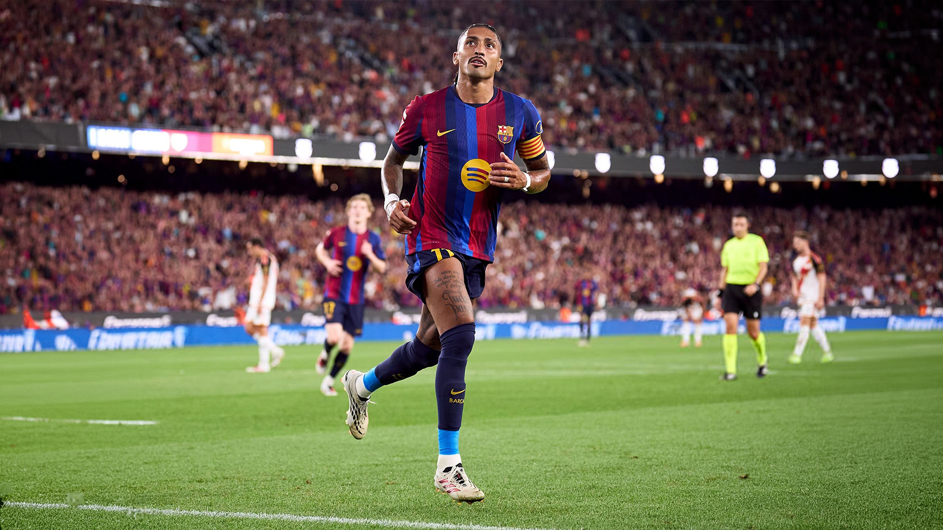 Lamine Yamal and Raphinha celebrate Barcelona’s win over Rayo Vallecano