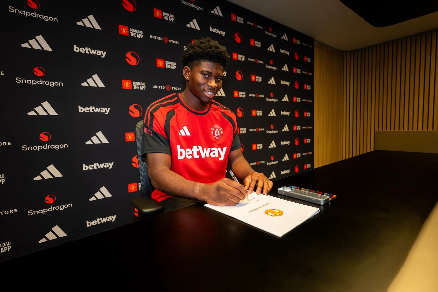 Carlos Baleba in Manchester United colours after his transfer from Brighton