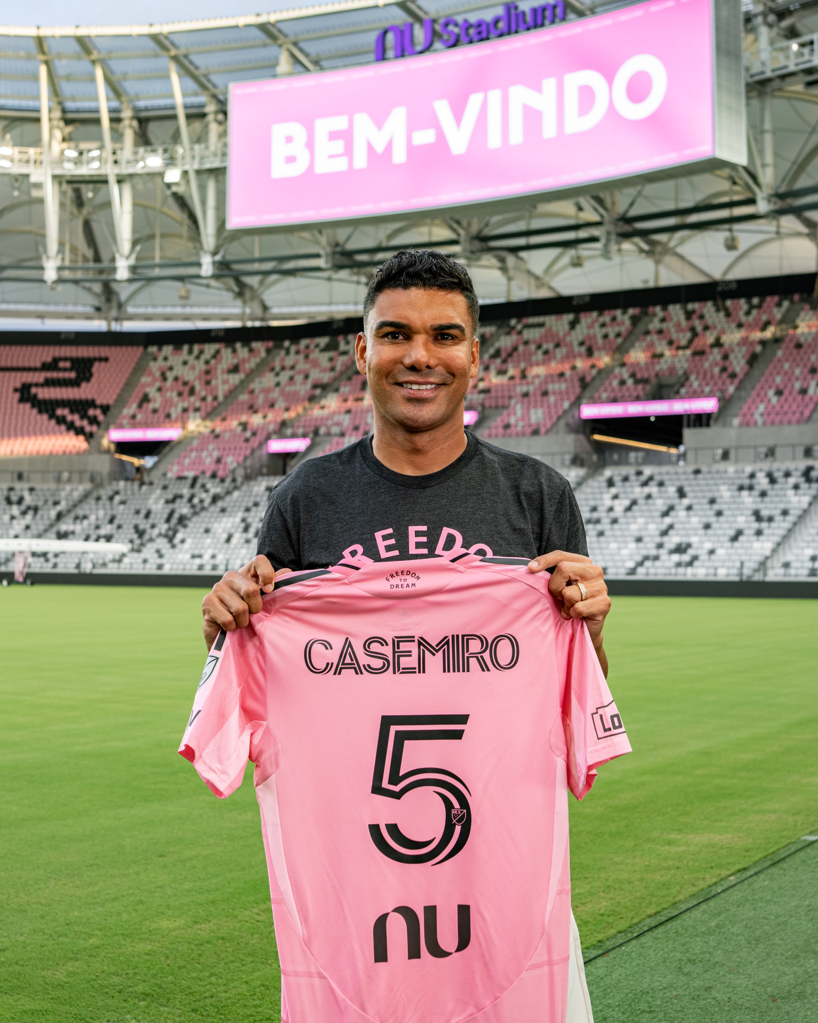 Casemiro holds up an Inter Miami jersey at his unveiling