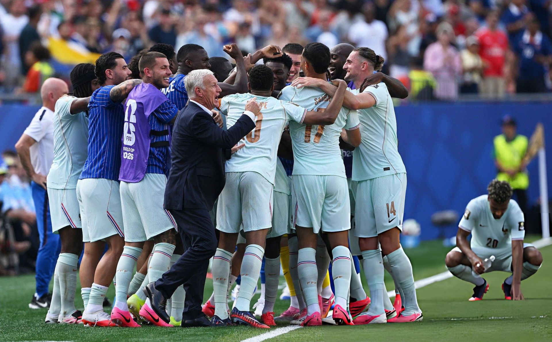 France players and manager Didier Deschamps celebrate reaching the semifinals after beating Morocco