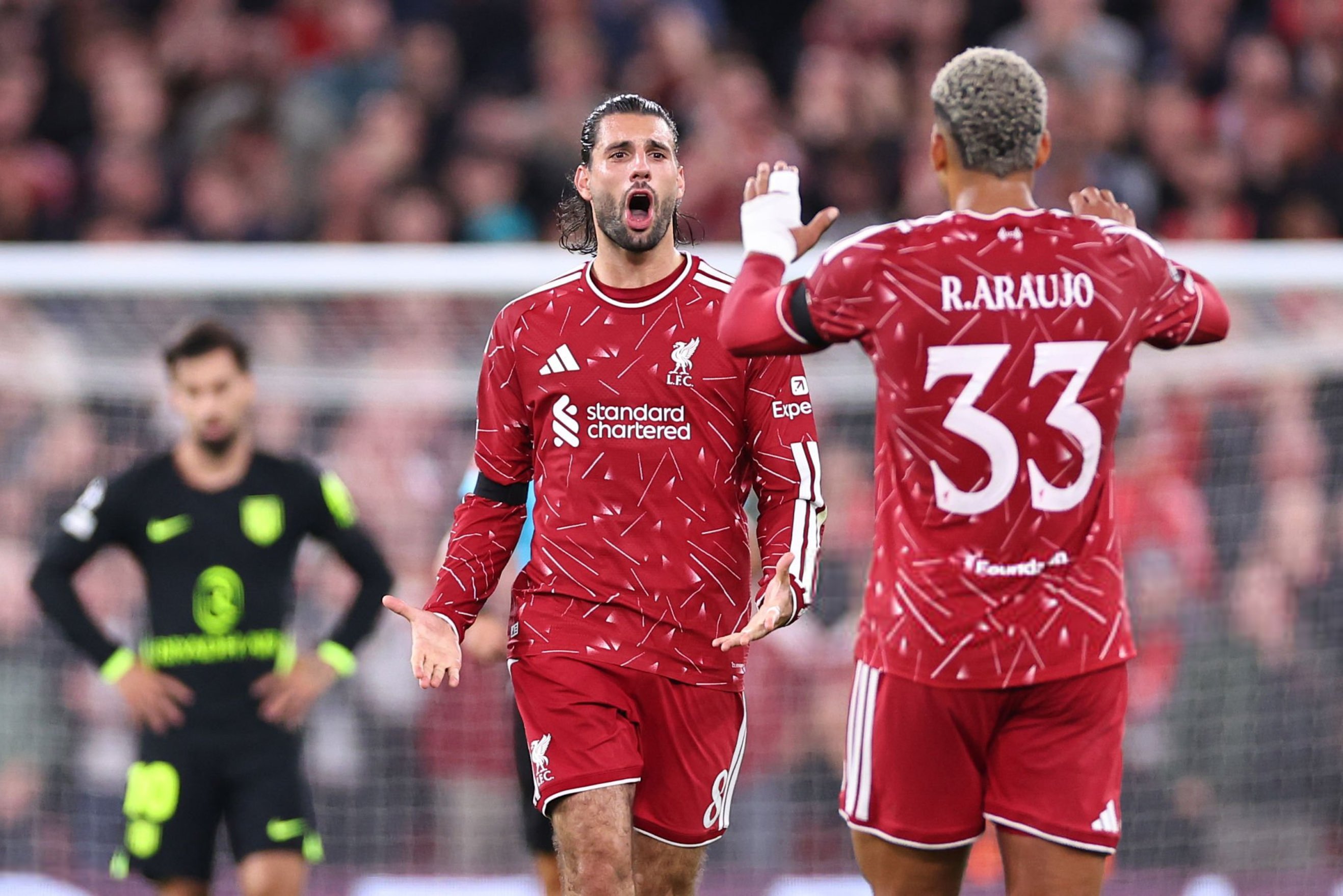 Dominik Szoboszlai and Alexis Mac Allister celebrate for Liverpool against Atletico Madrid