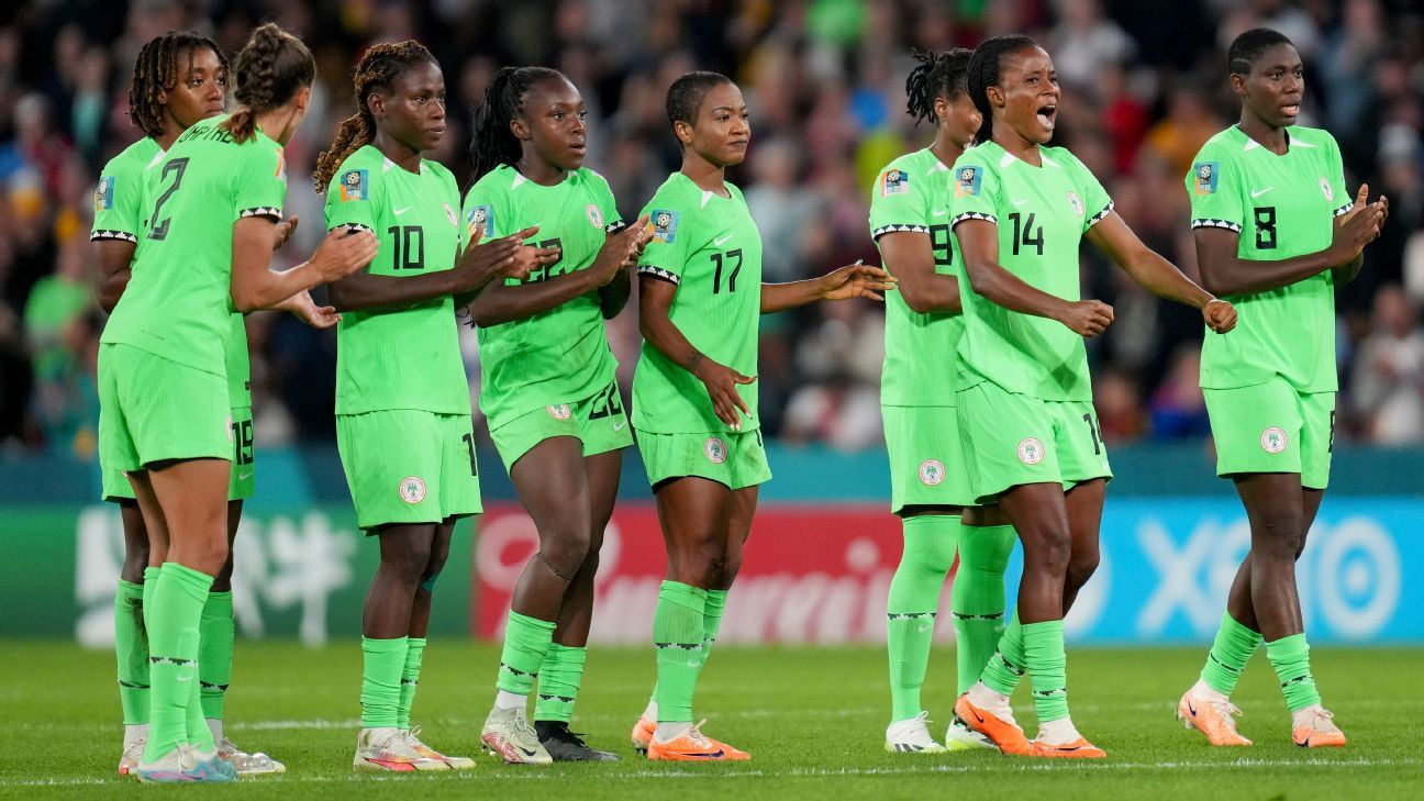 Nigeria's Super Falcons players celebrate together during a match