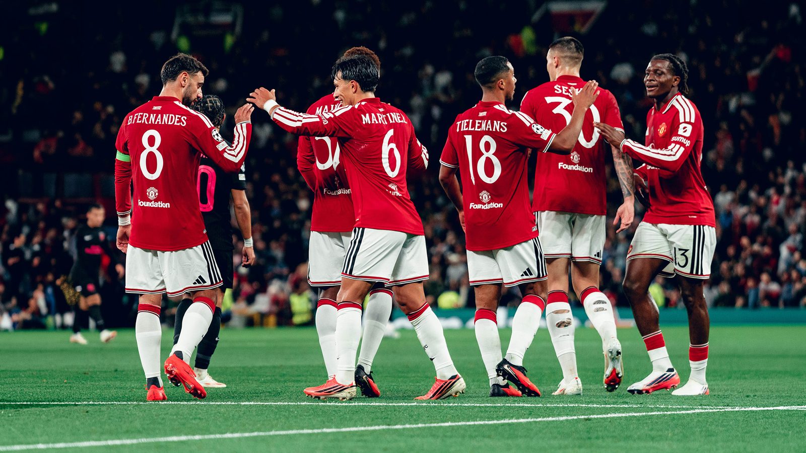 Manchester United players celebrate during their Champions League win over Sabah